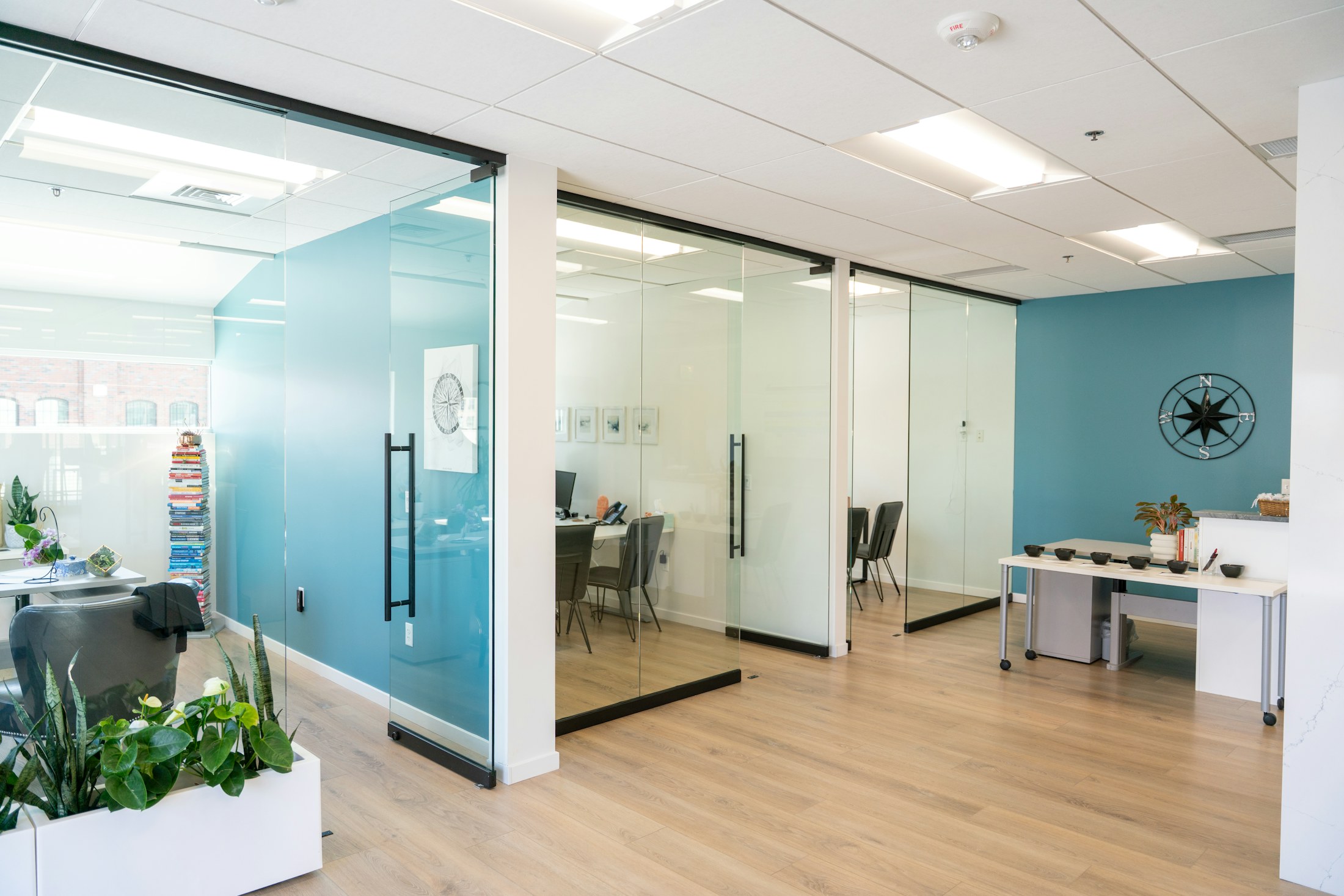 A precise modern interior with warm timber, glass and open collaborative spaces